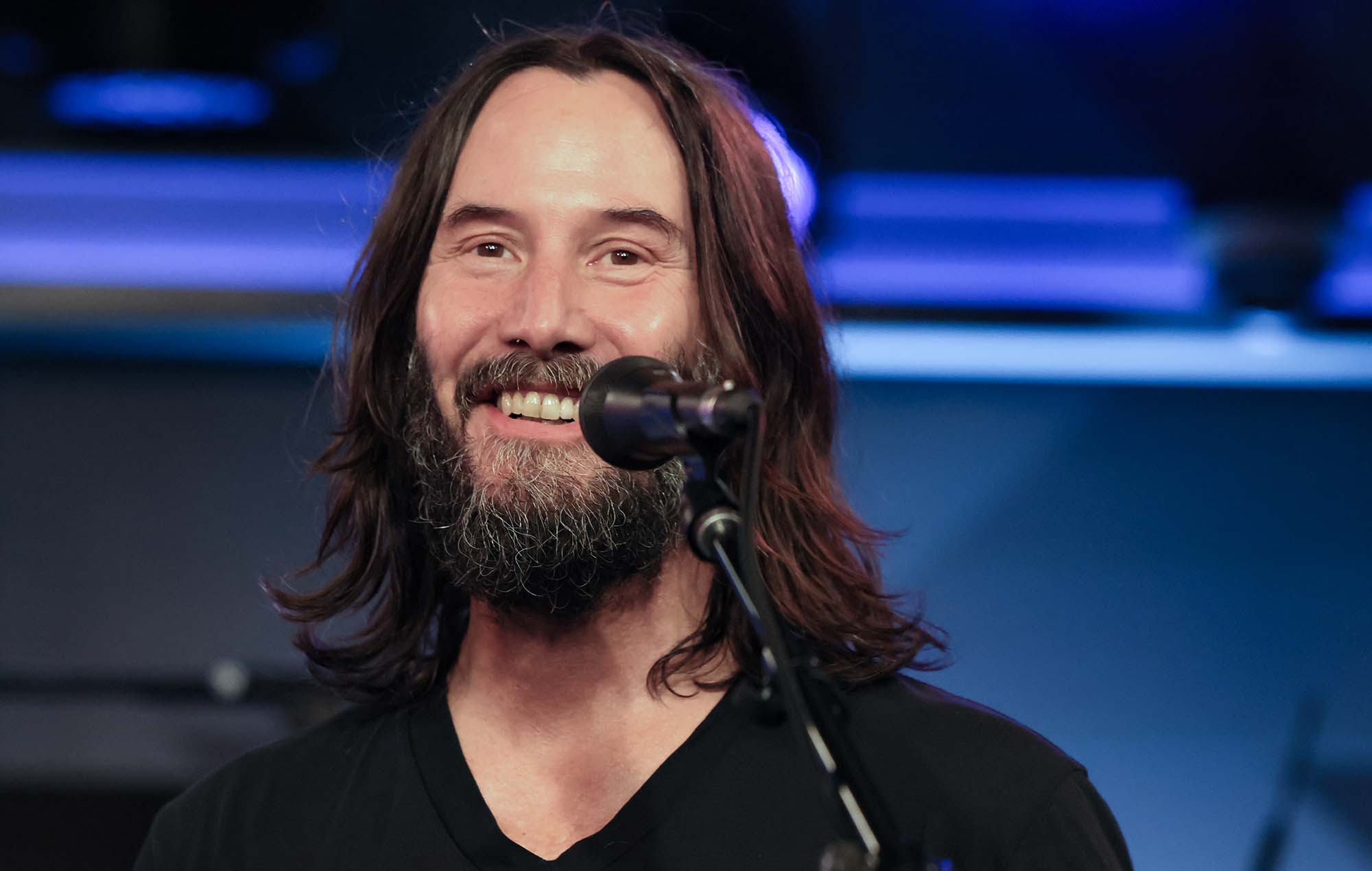 Keanu Reeves spotted playing catch with nine-year-old boy before concert
