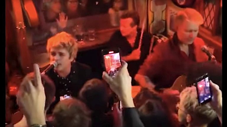 “We are Green Day, and this one’s called Welcome To Paradise”: Watch Green Day play a surprise secret acoustic show in a London pub