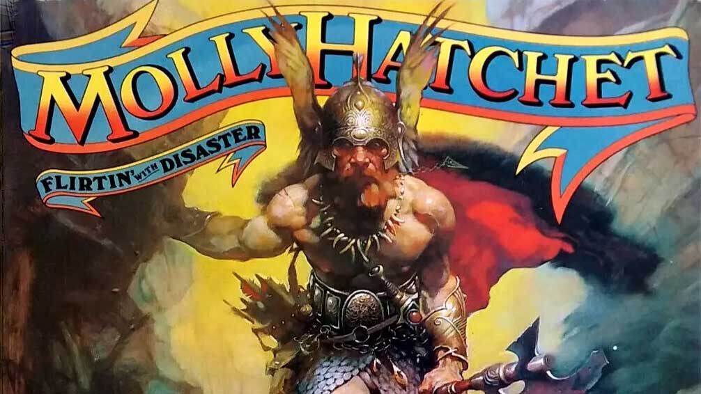 “These are hard-livin’, whiskey-drinkin’, gun-totin’ Southerners who eat grits for breakfast, fried beans for lunch, and an entire raw buffalo for their dinner”: Flirtin’ With Disaster by Molly Hatchet