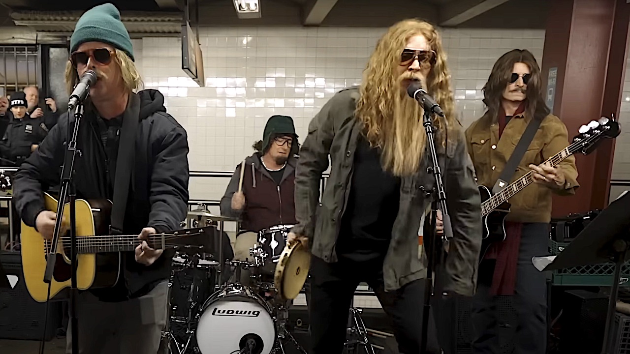 “We got a good crowd here!” Watch a heavily-disguised Green Day busk a hard rockin’ cover of Bad Company’s Feel Like Makin’ Love on a New York subway platform