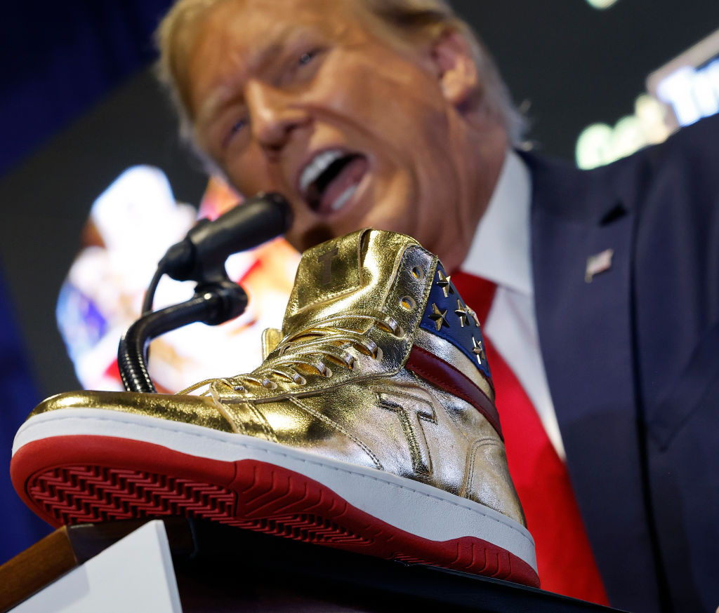 Donald Trump Booed At Sneaker Con While Selling Sneakers, X Clowns His Gold MAGA Fraud 1’s