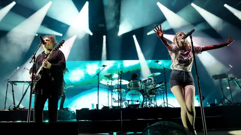 “He’s a true gem”: Chvrches look back on their collaboration with Robert Smith