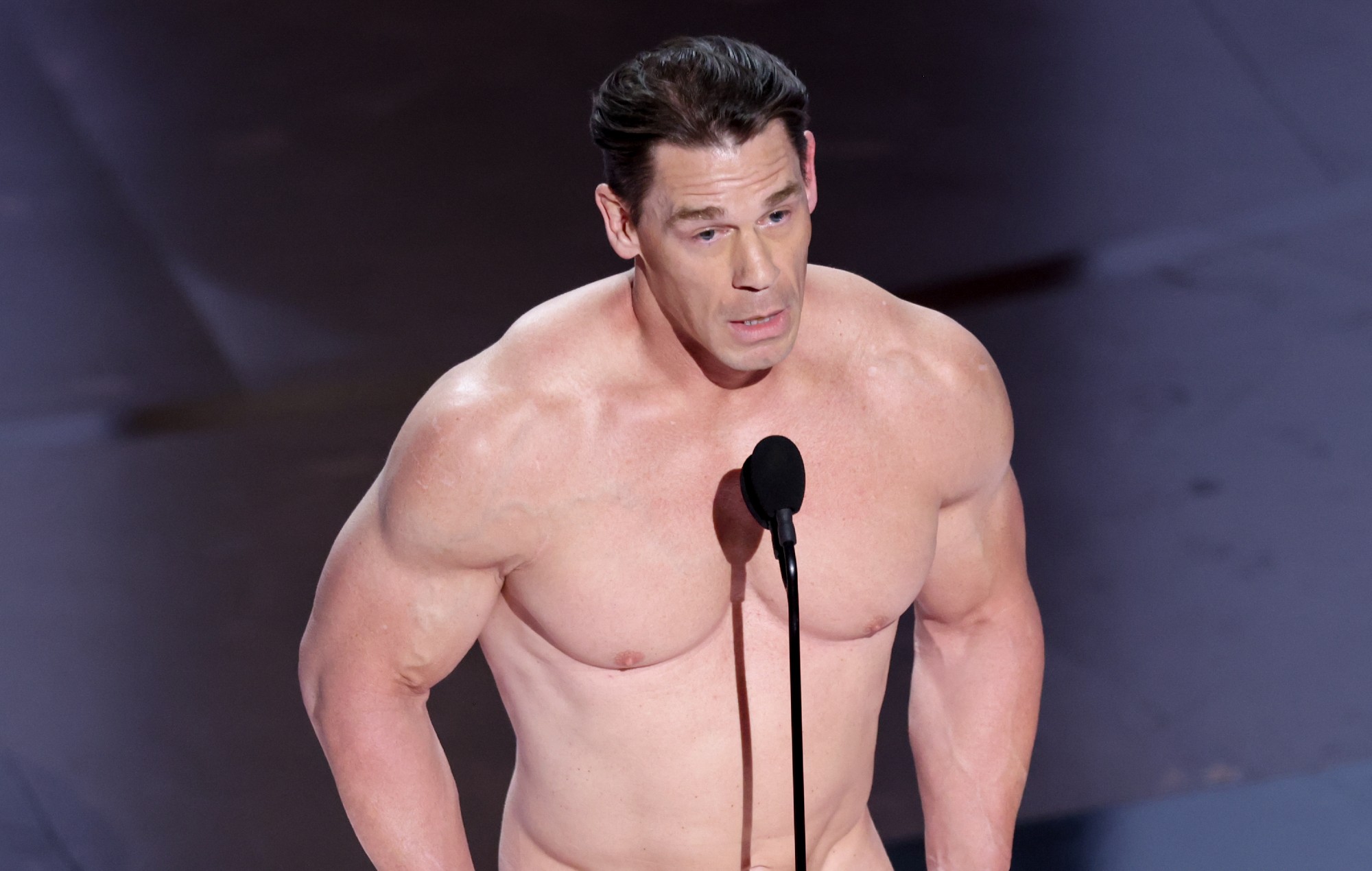 Watch John Cena present at the 2024 Oscars while naked