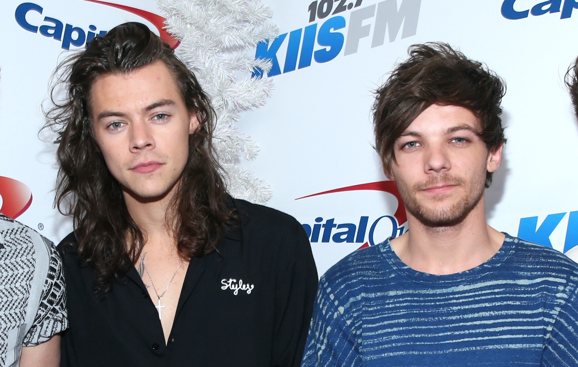 Louis Tomlinson admits Harry Styles relationship rumours are “irritating” and “far too personal”