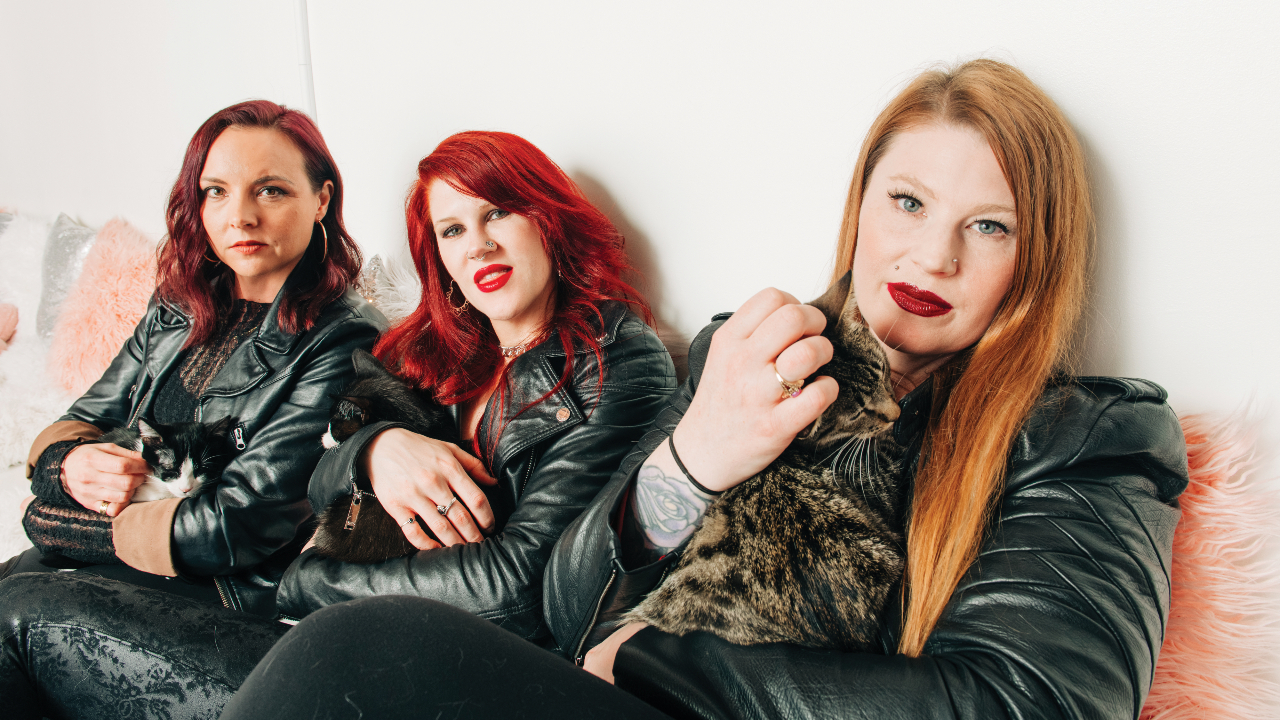 “I’ve got poop on me!” We took Kittie to a cat cafe (obviously) to ask them about their amazing comeback, the nu metal nostalgia train and surviving the music industry as a band of young women