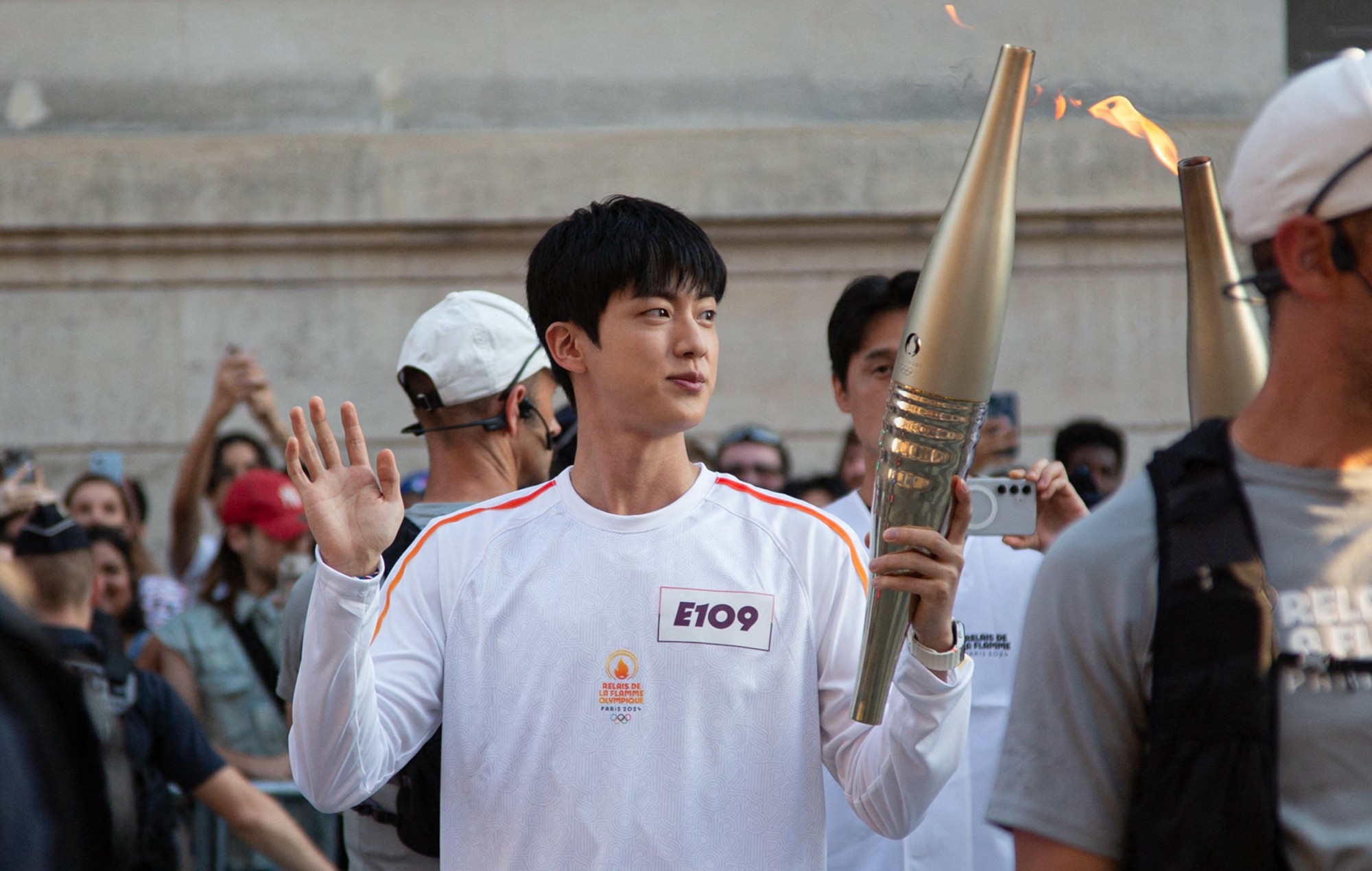 Watch BTS’ Jin carry the Paris Olympics torch as South Korea’s representative