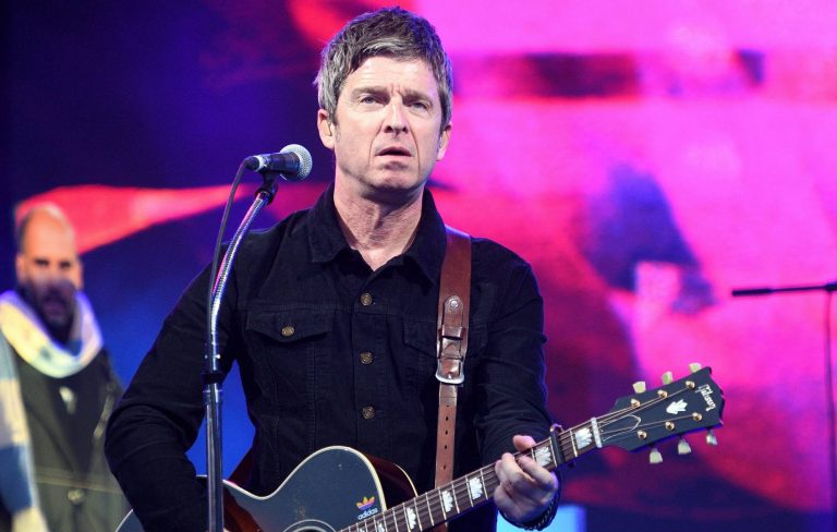 Noel Gallagher says Glastonbury has “gone woke” with ” little fucking idiots waving flags around”