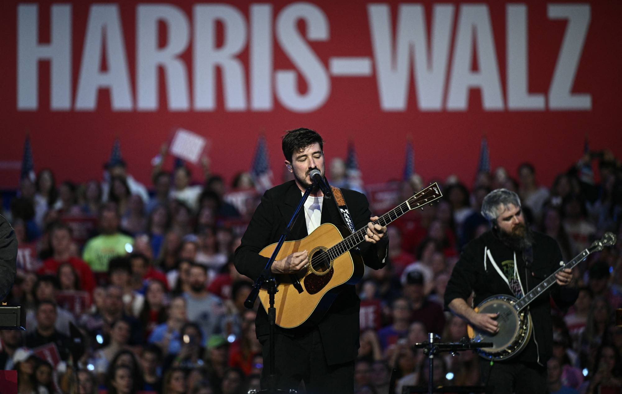 Watch Mumford & Sons push for “voting plan” as they perform at Kamala Harris rally