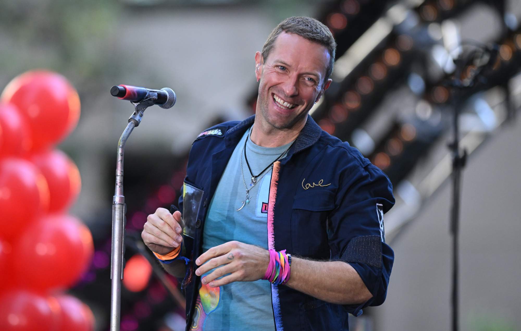 Watch Coldplay’s Chris Martin sit down for viral surprise interview with fan in park