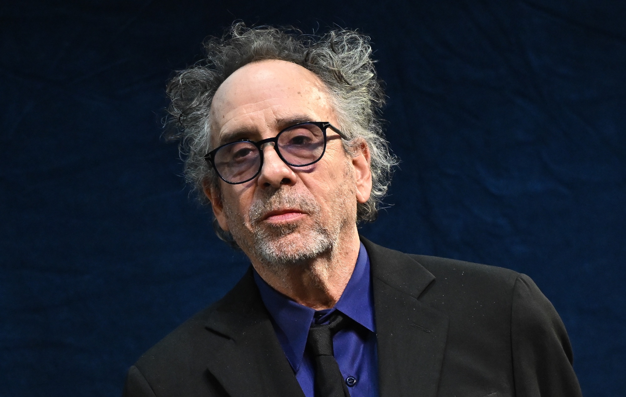 Tim Burton tries “to avoid” the internet because it makes him “depressed” and he’d rather look at clouds