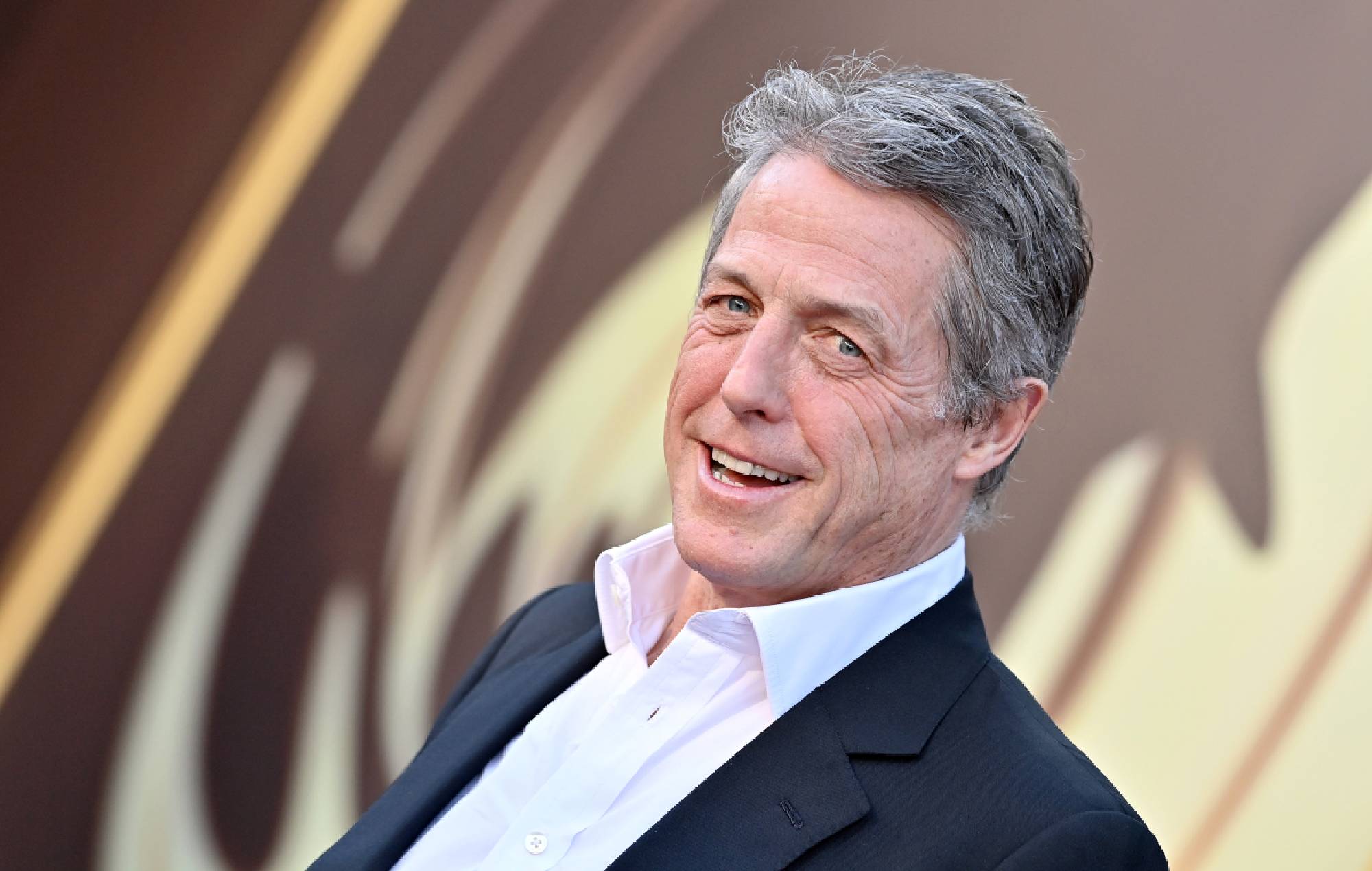 Hugh Grant calls his ‘Notting Hill’ character “despicable”: “Why doesn’t he have any balls?”