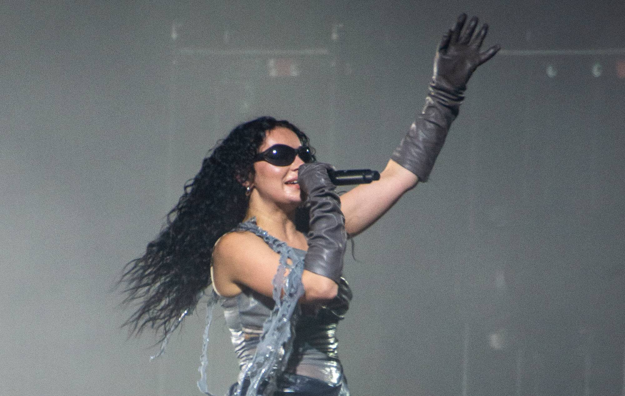 Charli XCX says she’s “often in a lot of pain” when performing onstage due to “nerve damage” in neck