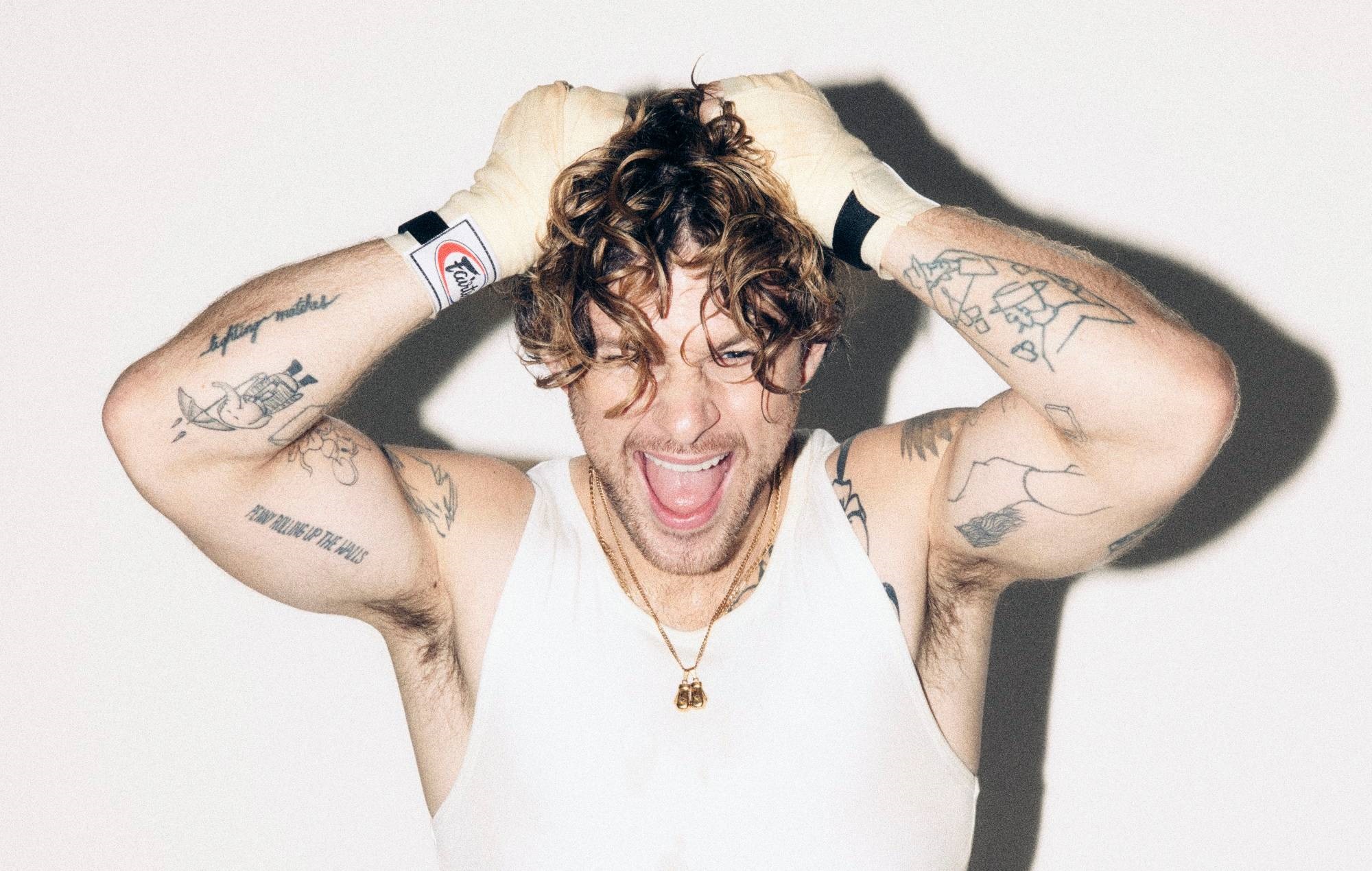 Tom Grennan shares euphoric single ‘Shadowboxing’ and announces new album ‘Everywhere I Went Led Me To Where I Don’t Want To Be’ along with UK tour