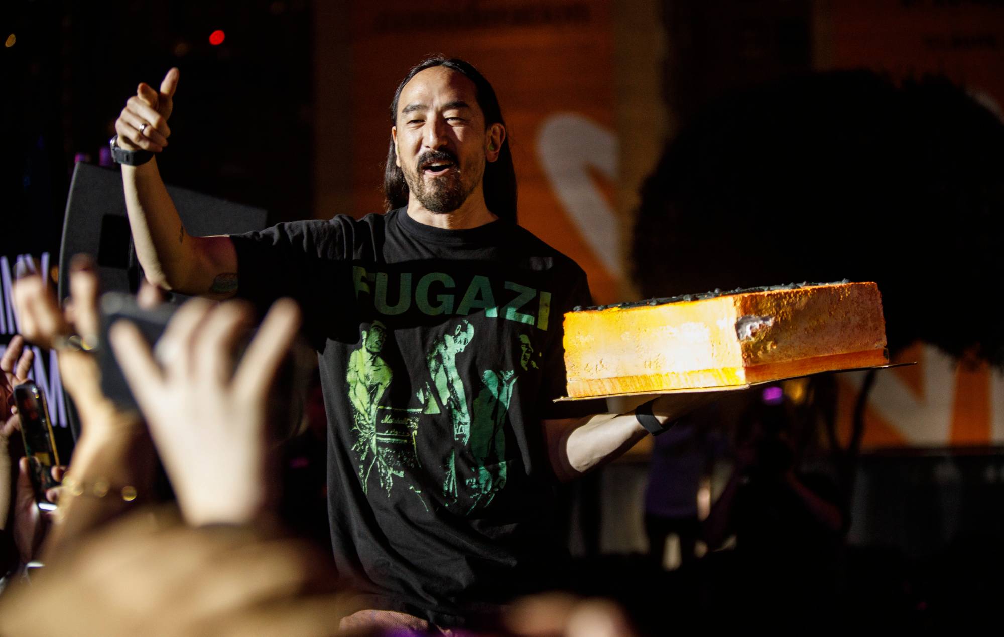 Watch Steve Aoki deliver live gender reveal for his baby by smashing face into cake