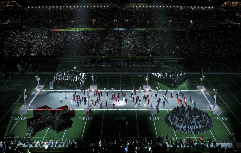 Gamers go wild as Kendrick Lamar performs on a PlayStation controller for Super Bowl Halftime Show