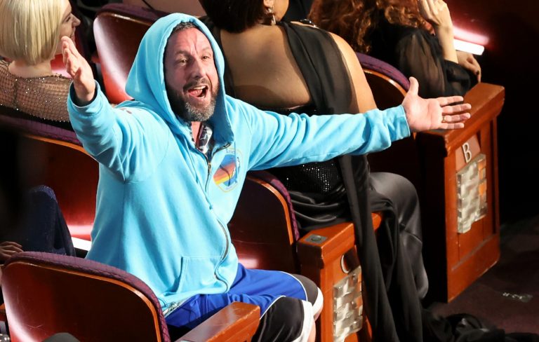 Adam Sandler’s hoodie stole Oscars night: “the GOAT of comedy”