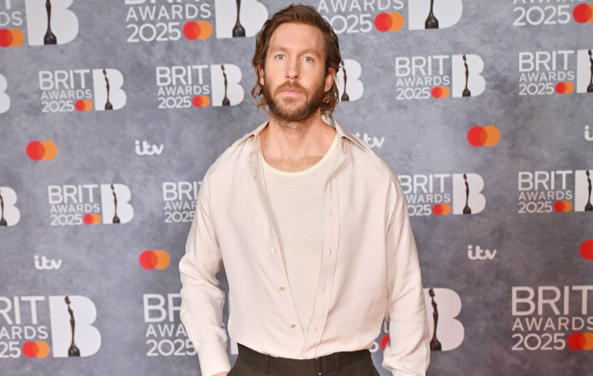 Calvin Harris teases new country song ‘Smoke The Pain Away’ – featuring himself on vocals and guitar