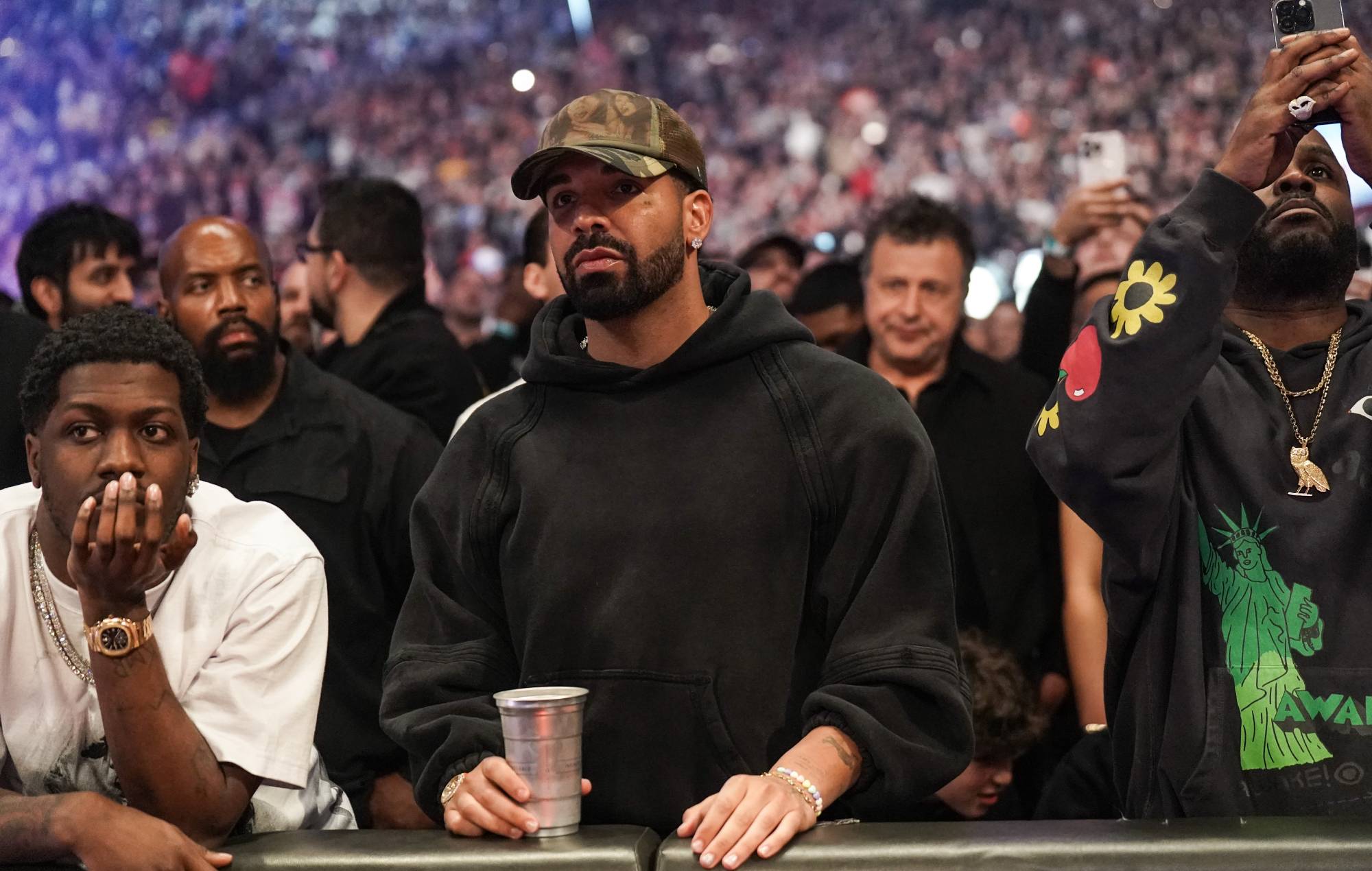 Drake seen front row at WWE event after postponing tour dates due to “scheduling conflict”