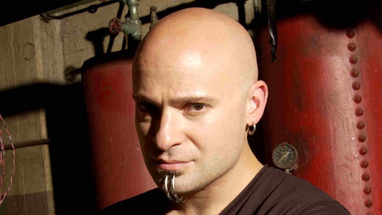 “People are intimidated, or say I give off some bad vibe. But if you want to get a reaction out of a crowd, you better have an ego”: How Disturbed’s David Draiman became the metal star the press loved to hate