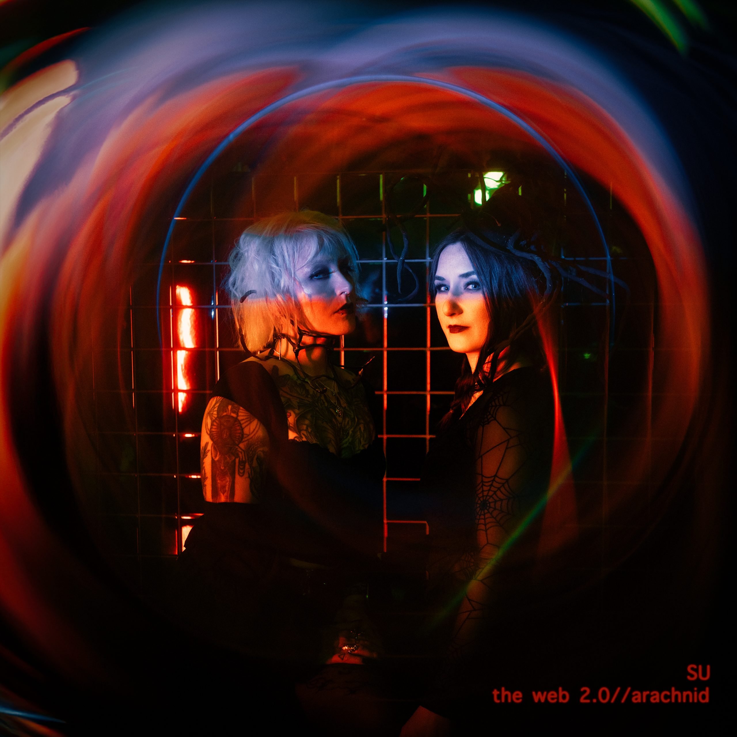 Dark and Ethereal Duo SU Weave a Macabre Web in Their Candlelit Video for “Arachnid”