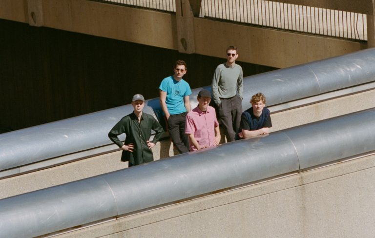 Squid share “punky” new single against “mass censorship and propaganda”: ‘The Hearth And Circle Round Fire’