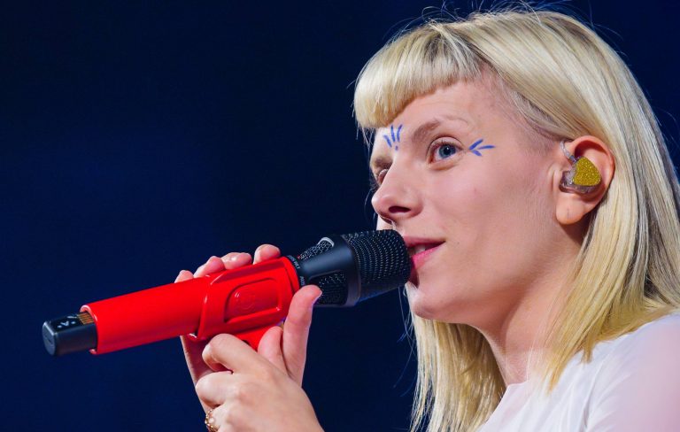 AURORA faces “the invisible enemy” of anger and sadness on enchanting new single ‘The Flood’