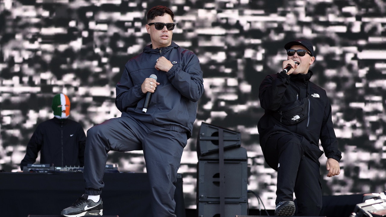 Kneecap issue defiant statement amid news that counter-terrorism police are analysing footage from two past shows, as calls for the Irish band to be removed from UK festival bills escalate