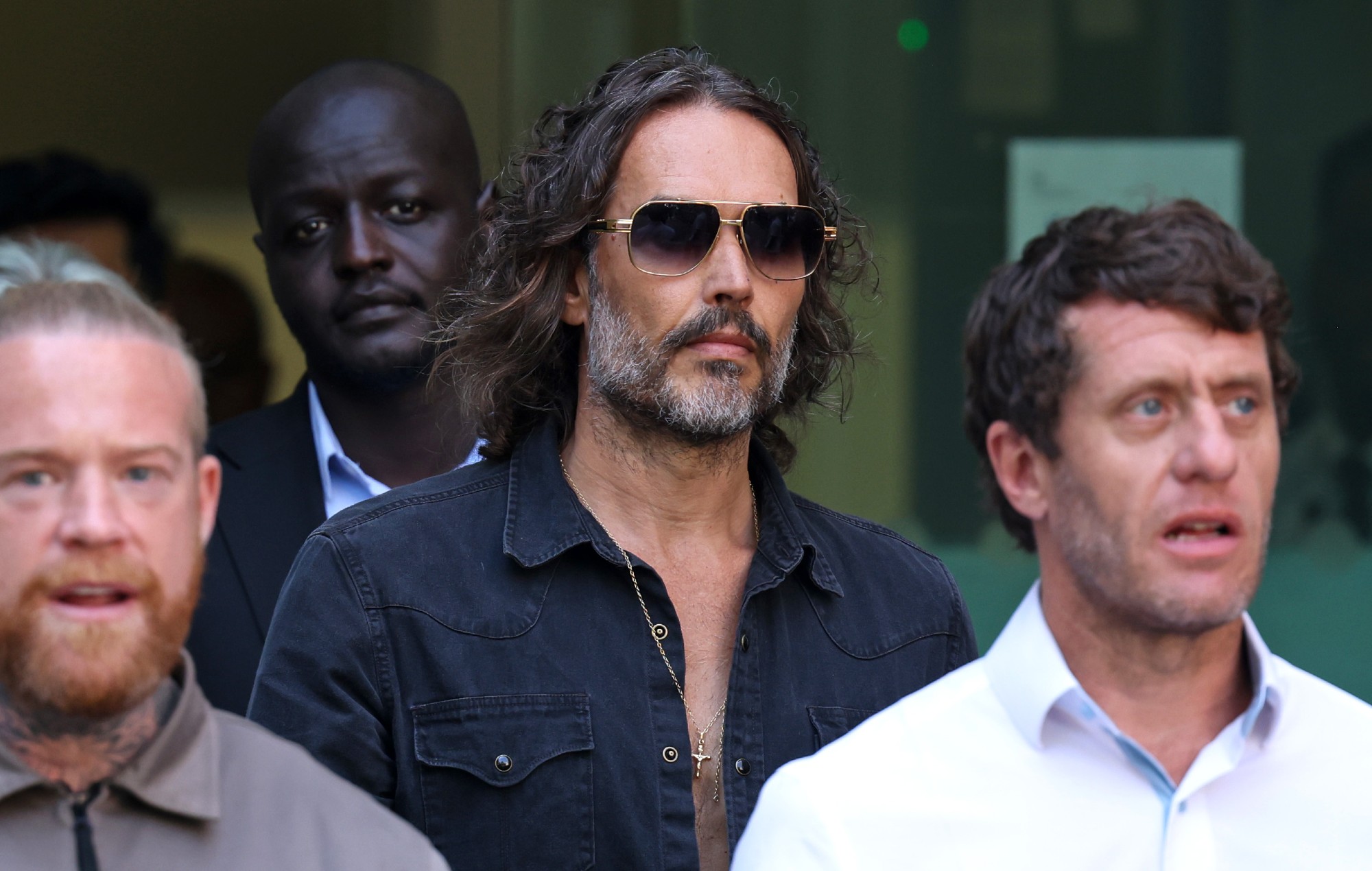 Russell Brand pleads not guilty to rape and assault