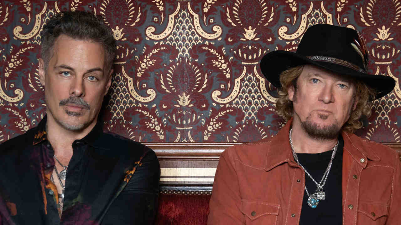 “People on their mobiles, getting bombarded with this information –it’s kind of like brainwashing”: Adrian Smith and Richie Kotzen are waging a two-man war on the modern world with Smith/Kotzen