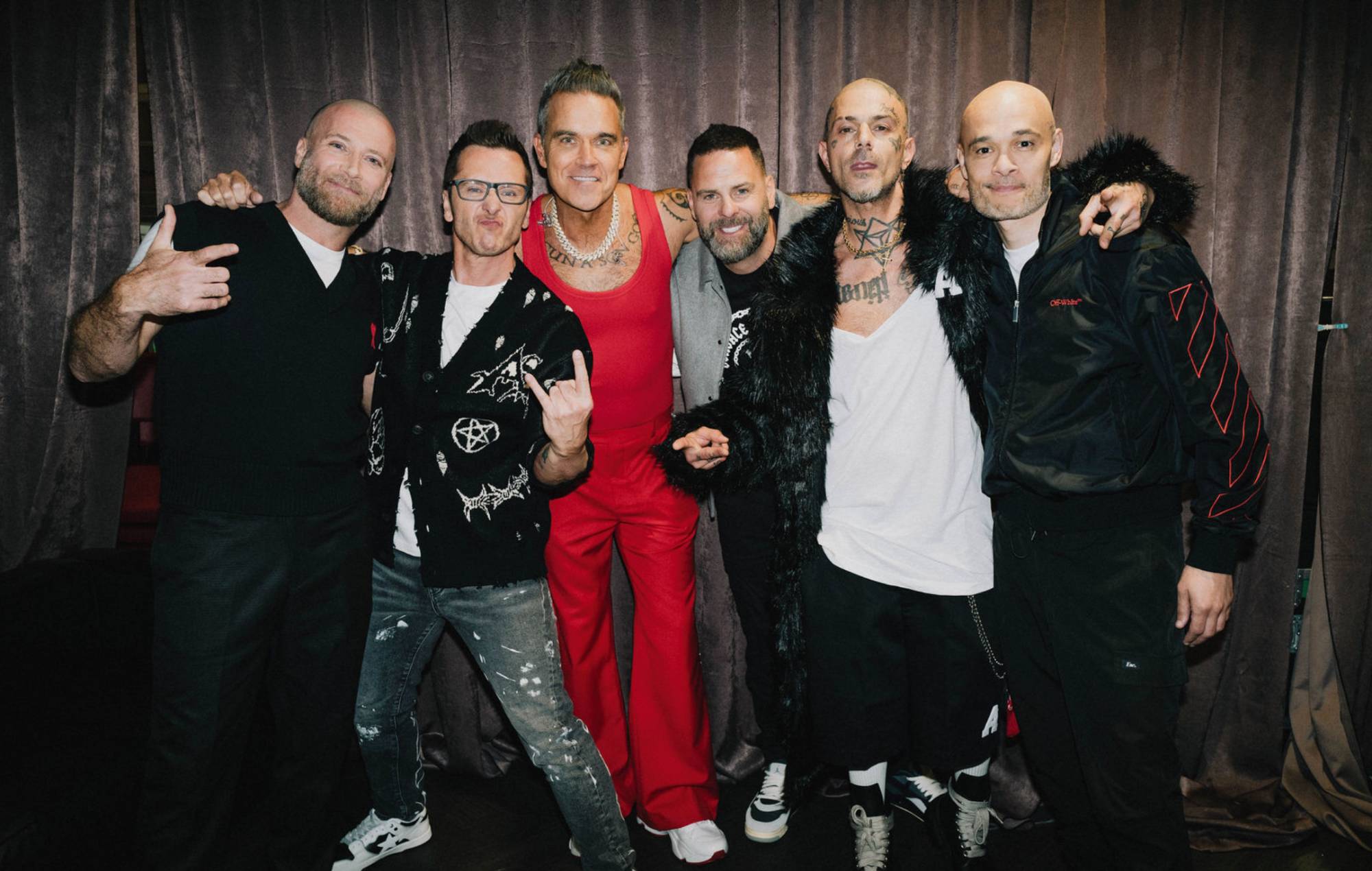 Watch Five perform live for first time in 25 years as surprise guests at Robbie Williams’ London show
