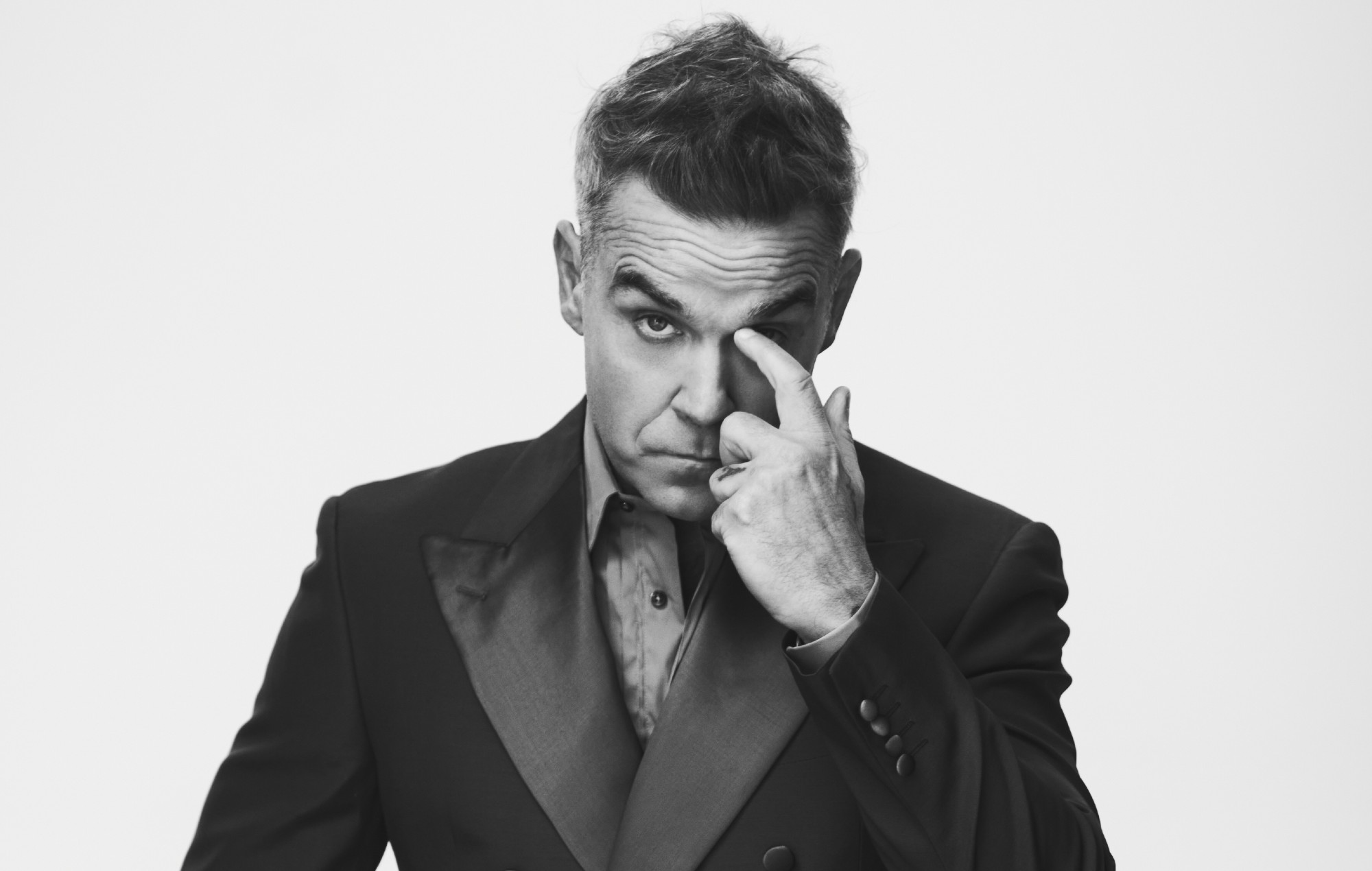 Robbie Williams teases secret Glastonbury 2025 set 30 years after partying with Oasis at the festival