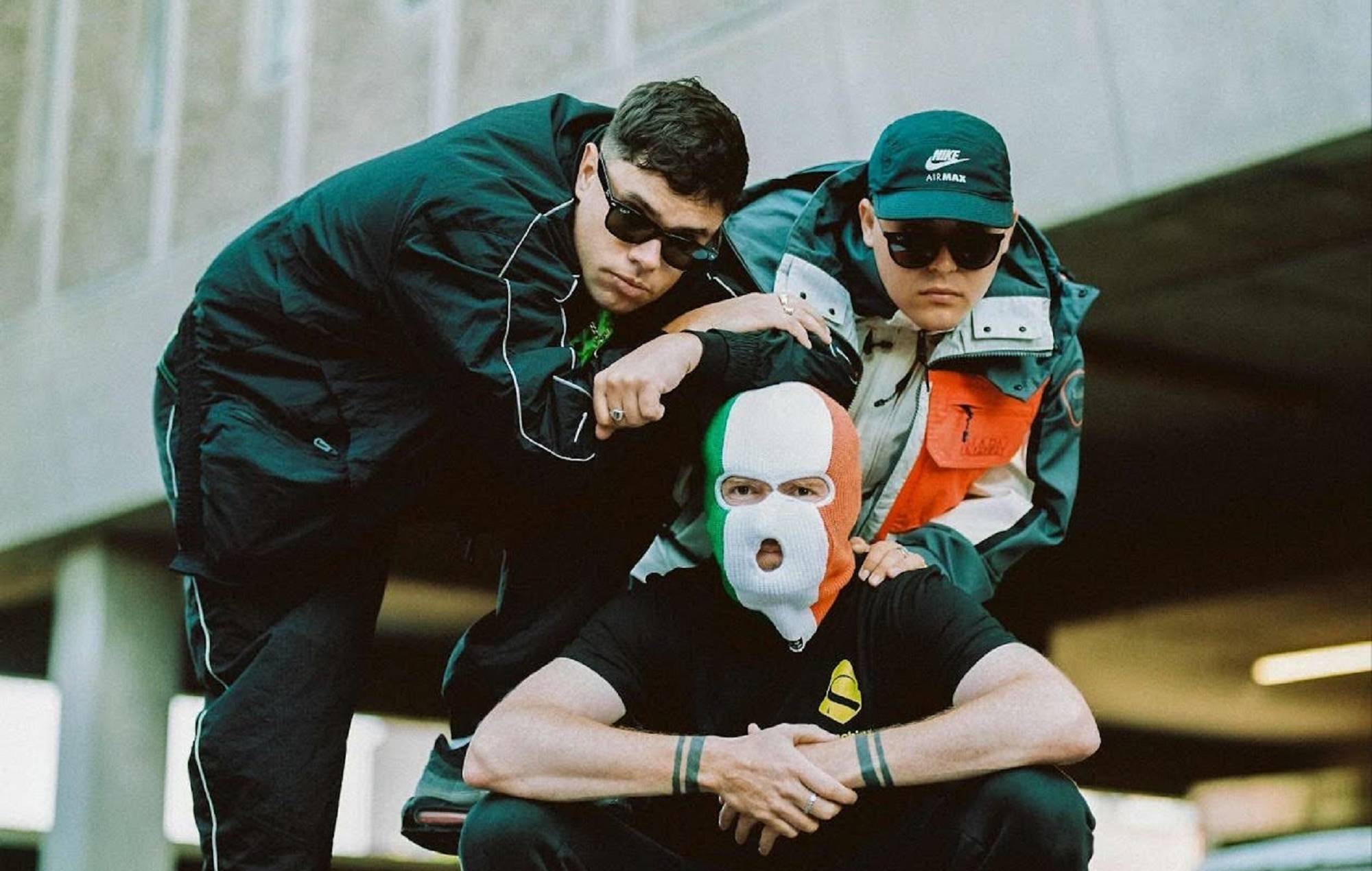 Kneecap share lively ‘The Recap’ video: “More Blacks, More Dogs, More Irish, Mo Chara”