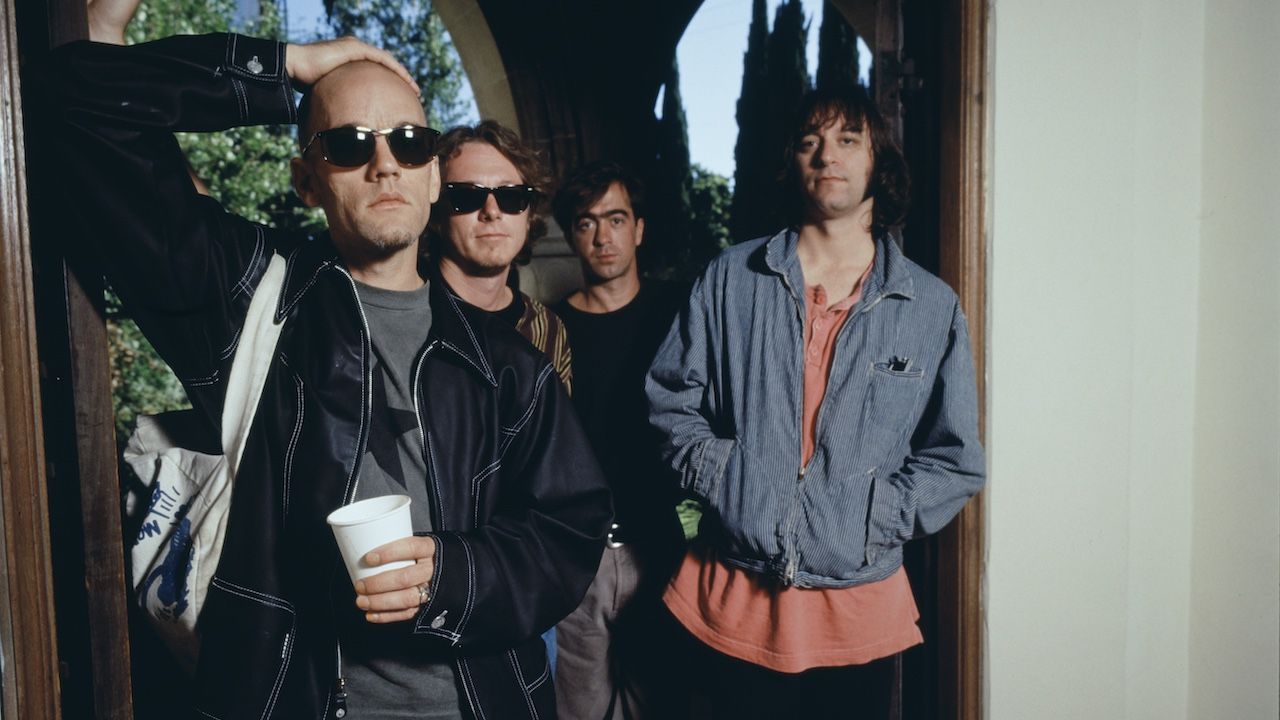 “We were sunbathing together outside of the dressing rooms”: Thirty years ago, R.E.M. befriended a young British band and helped steer them on the path to greatness