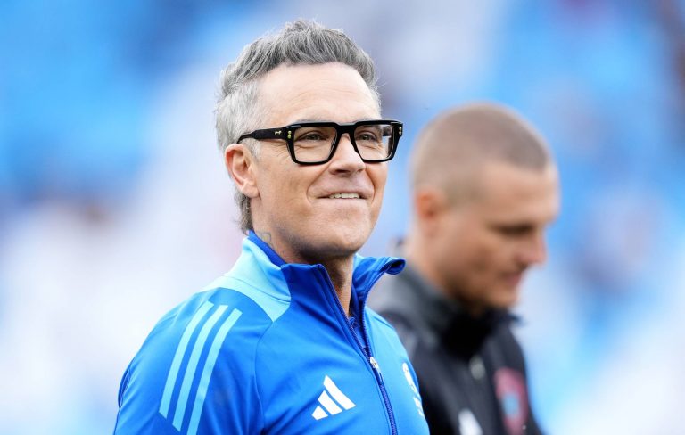 Robbie Williams shares first ever official FIFA anthem, ‘Desire’: “Music and football bring people together like nothing else”