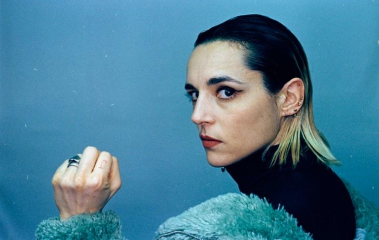 Jehnny Beth fends off “brain rot caused by endless phone scrolling” on relentless new single ‘High Resolution Sadness’  