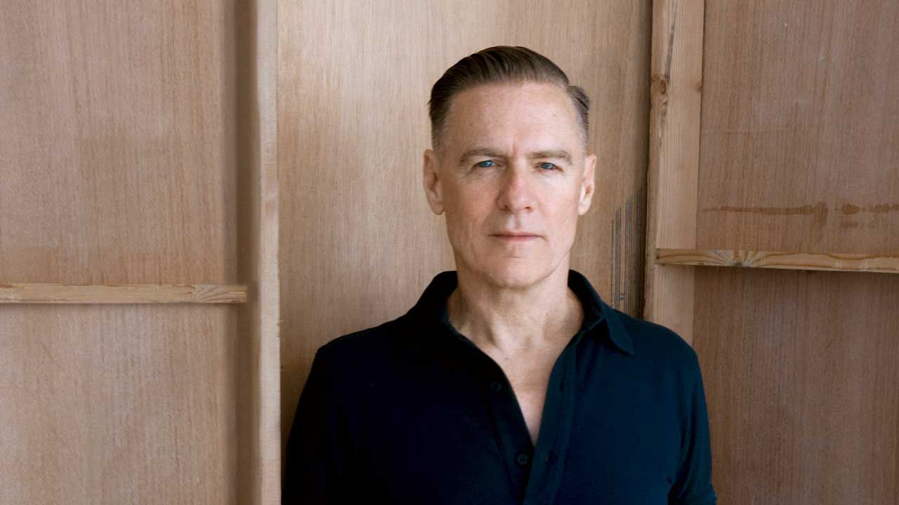 “Now in his mid-60s, there’s still something oddly teenage about Bryan Adams”: Soft rock’s Mr Nice Guy returns to familiar ground