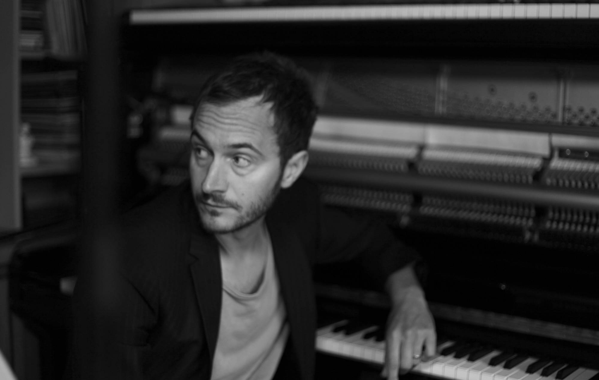 Editors’ Tom Smith announces debut solo album with “dreamlike, hopeful” single ‘Life Is For Living’