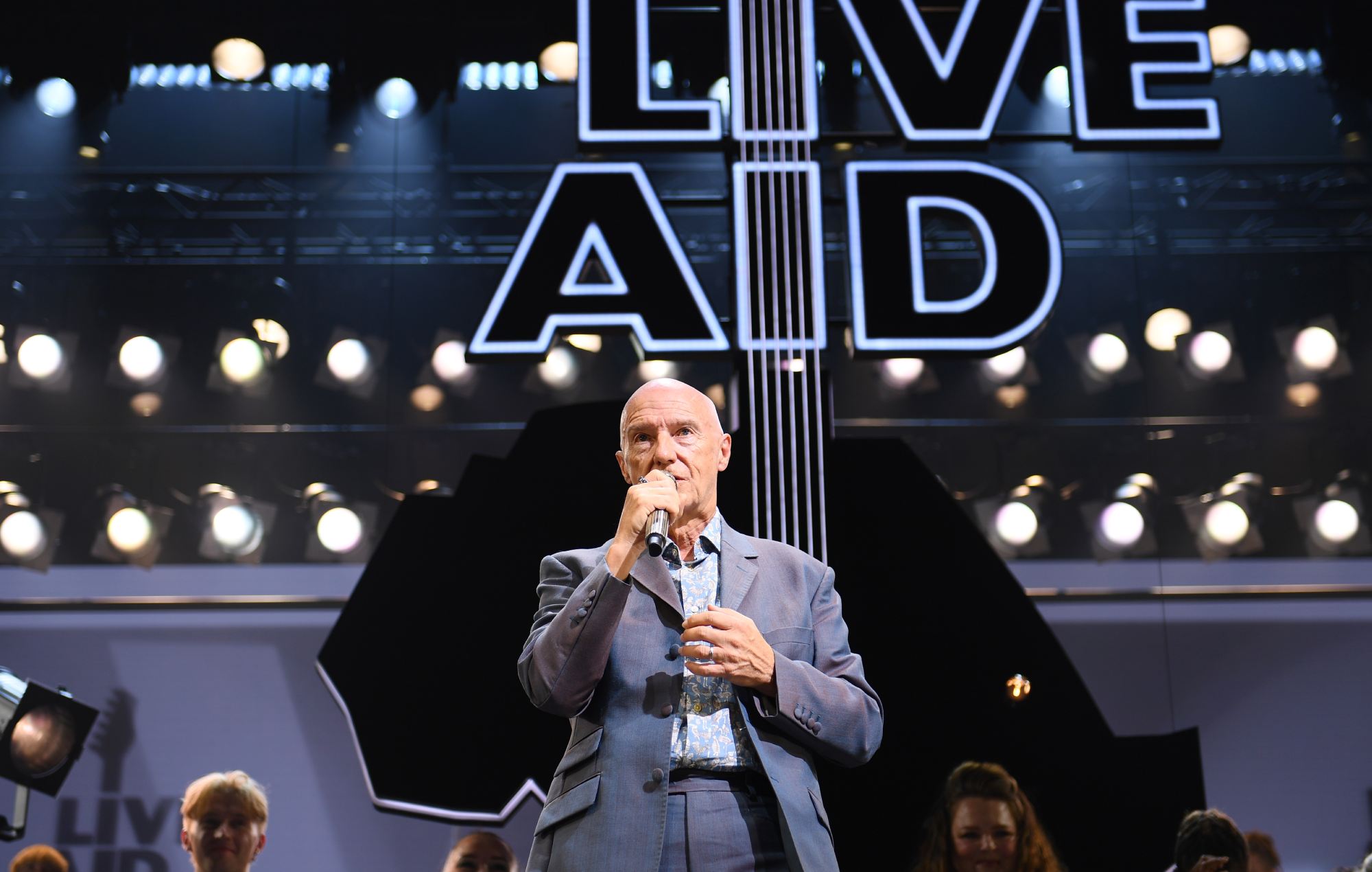 Midge Ure reschedules tour dates due to “health issue that requires urgent treatment”