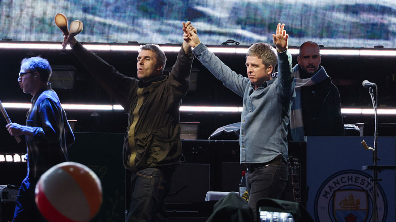 Fans revel in downpour as Oasis kick off North American leg of world tour in Toronto