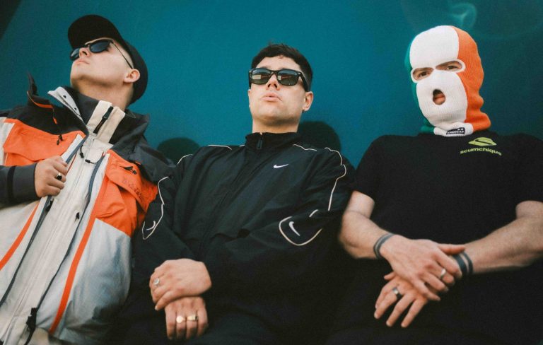 Kneecap share hedonistic video for massive new Paul Hartnoll collab single ‘Sayōnara’ featuring Jamie-Lee O’Donnell from ‘Derry Girls’