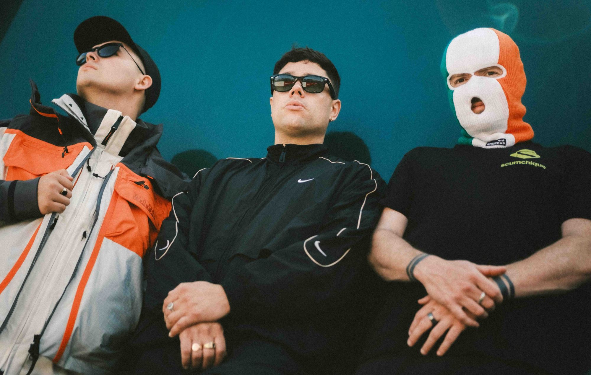 Kneecap share hedonistic video for massive new Paul Hartnoll collab single ‘Sayōnara’ featuring Jamie-Lee O’Donnell from ‘Derry Girls’