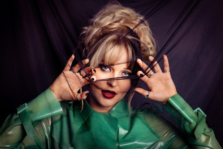 Goth-glam pop star Luvcat delights in drama: “It bores me to be sad”