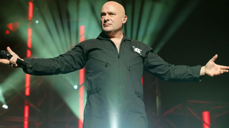 Disturbed say they want their music to “heal people” after their singer signed a bomb and caused their Belgium gig to be cancelled