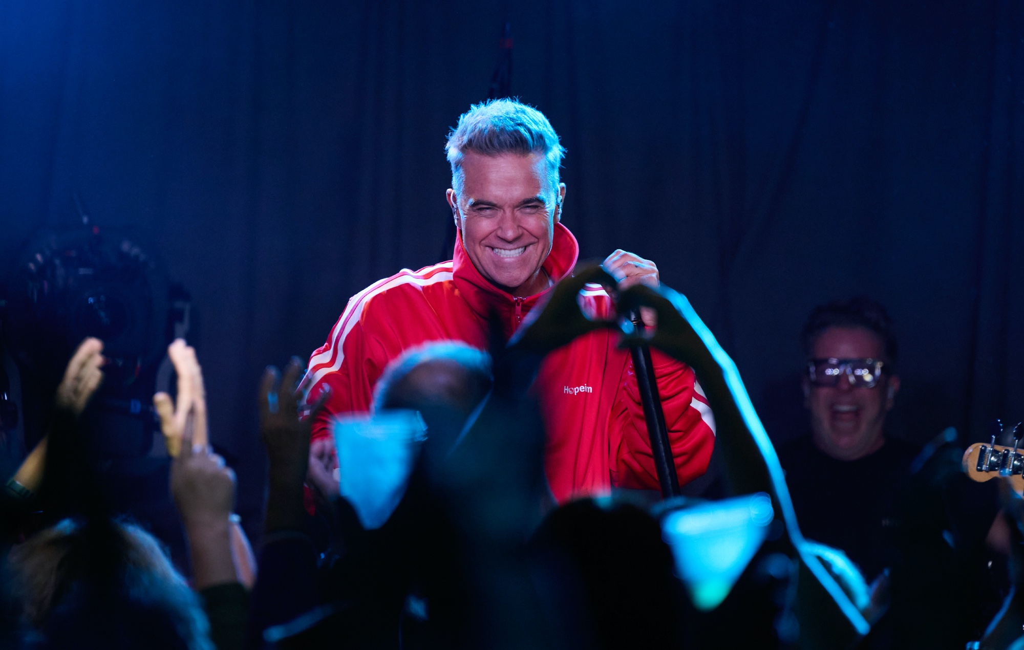 Robbie Williams previews ‘BRITPOP’ and plays debut album in full at tiny London gig: “These songs have reached their destination”