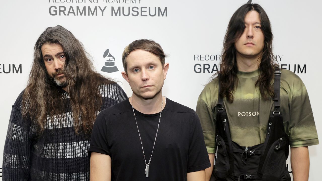 “The world is awful – refusing to have a boogie won’t make anything better, though”: Sleep Token-backed industrial champions Health dance in the face of despair on new album Conflict DLC