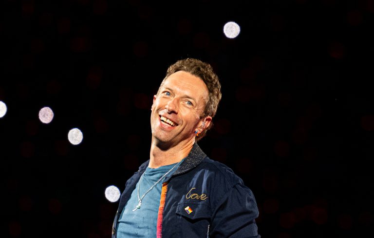 Coldplay’s Chris Martin surprises newlyweds by singing first dance at their wedding