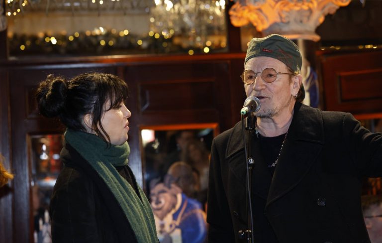 Watch Bono and Imelda May sing ‘Christmas (Baby Please Come Home)’ at annual Dublin busking gig