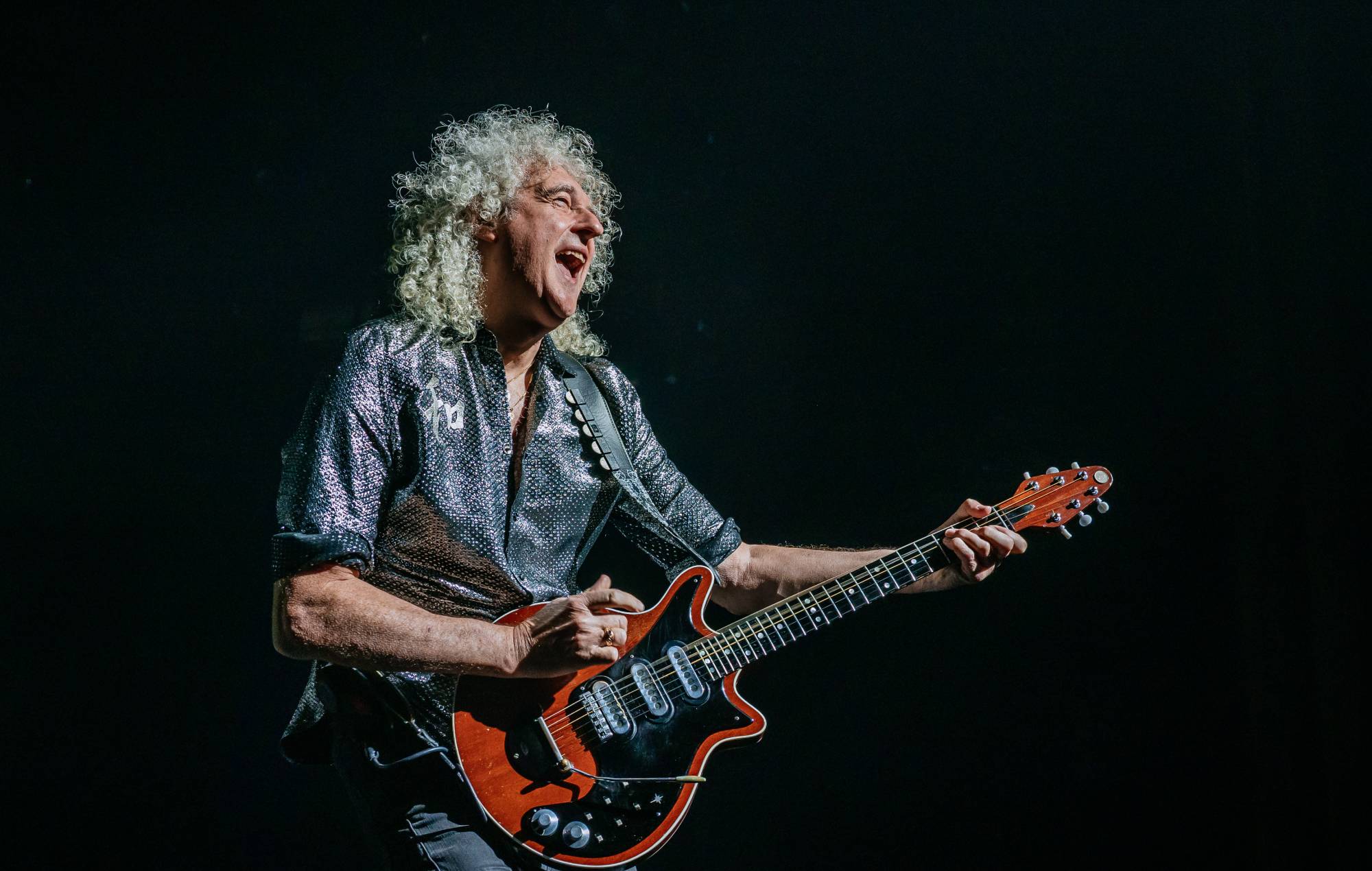 Brian May says Queen won’t be playing Glastonbury because of “politics”: “They like killing badgers”