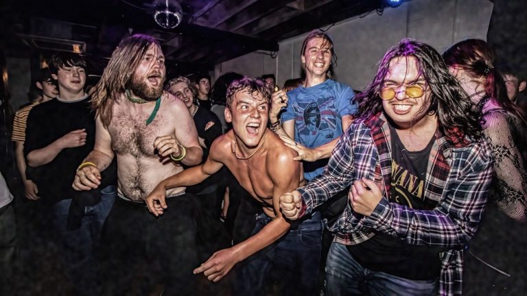 “The collective mood is influenced by the combination of loud, fast music, synchronized with bright flashing lights, and frequent intoxication.” What the science behind mosh pits can tell us about human behaviour