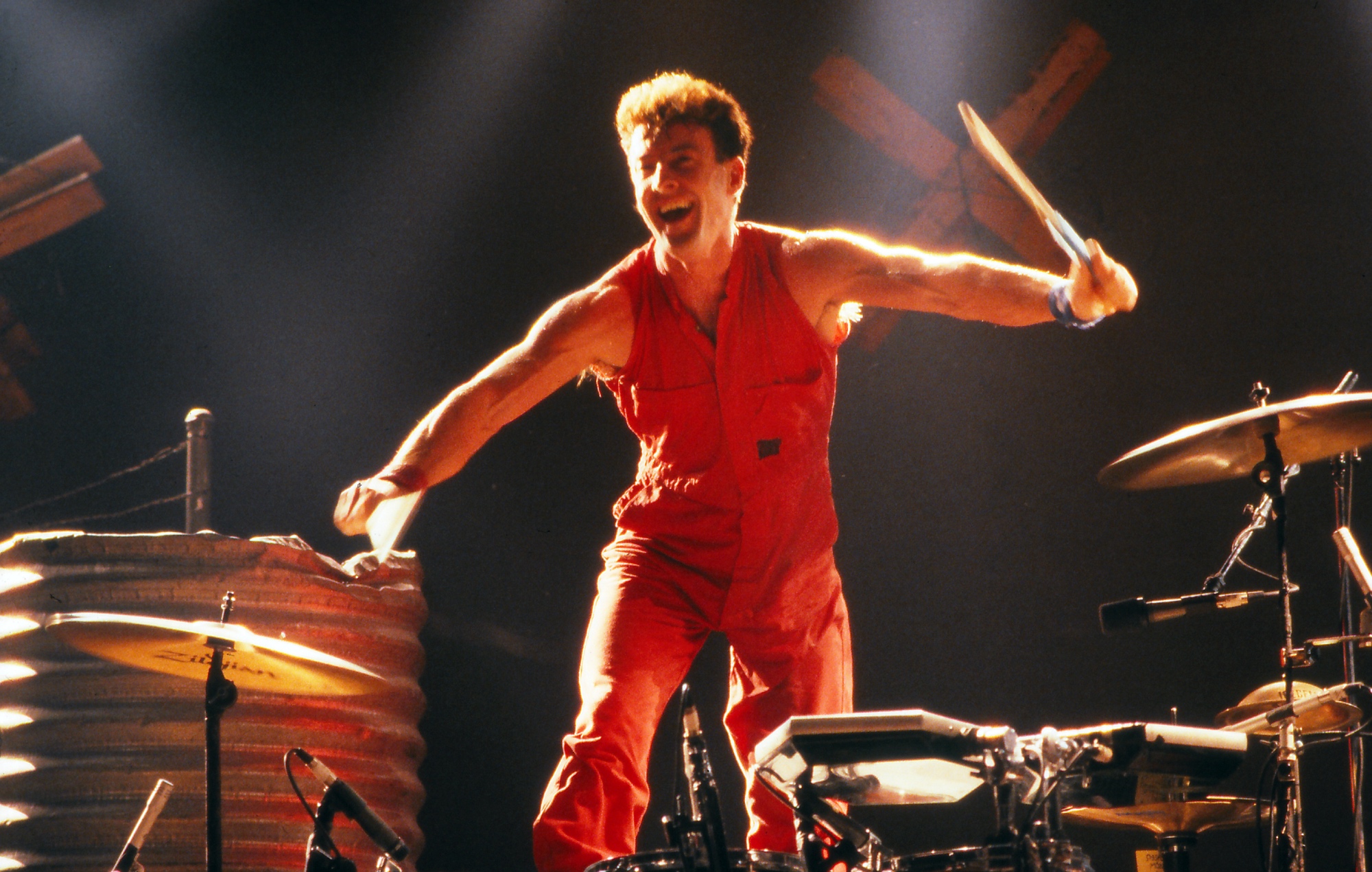 Tributes paid as Midnight Oil founder and drummer Rob Hirst dies, aged 70: “An absolute beast behind the kit”